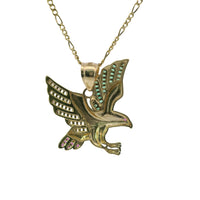 14KT Gold Charm Small Left Facing Soaring Eagle with Baguettes White, Red, and Green CZ Stones Wings, Red CZ Stones Eye and Plain Bell