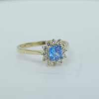 14KT Gold Flower Women's Ring Square Light Blue Center with White CZ Stone Petals Border Plain Band