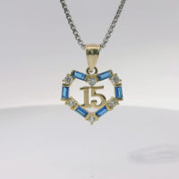 14KT Gold Charm Medium Quinceanera Open Heart with Royal Blue Baguette and White Round CZ Stones Outline with Plain Bell