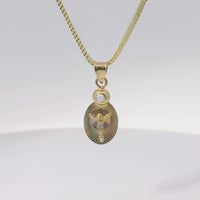 14KT Gold Charm Extra Small Tri Tone Oval Crucifix Graphic Coin with White CZ Stone Top and Plain Bell