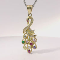14KT Gold Charm Peacock with Multicolor CZ Stones Tail White CZ Stones Body and Dark Pink CZ Stone Eye and Plain Bell