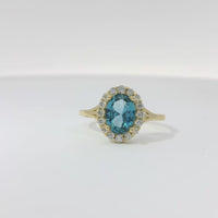 14KT Gold Ring Women's Oval Turquoise CZ Stone Center with Round White CZ Stones Border and Mini Plain Double Split Band