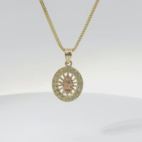 14KT Gold Charm Extra Small Oval Two Tone Virgin Mary Open Stripe Center with White CZ Stones Border and Plain Bell