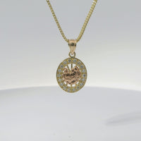 14KT Gold Charm Small Oval Two Tone Communion Open Stripe Center with White CZ Stones Border and Plain Bell