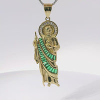 14KT Gold Charm Medium St Jude Shape with White Baguette CZ Stones Halo and Dark Green Baguette CZ Stones Robe with Plain Bell