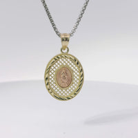 14KT Gold Charm Medium Oval Two Tone Virgin Mary Lattice with Diamond Cut Border and Plain Bell