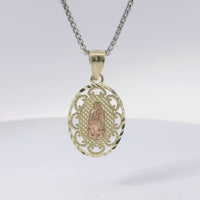 14KT Gold Charm Medium Two Tone Virgin Mary Oval Lattice Background and Diamond Cut Open Swirl Frame and Plain Bell