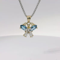 14KT Gold Charm Small Two Tone Quinceanera Butterfly with Light Blue CZ Stones Top Wings and White CZ Stones Lower Wings and Plain Bell