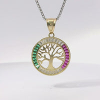 14KT Gold Charm Large Round Open Center Tree of Life with White, Red, and Green Baguette CZ Stones Border and Plain Bell