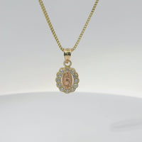 14KT Gold Charm Extra Small Oval Two Tone Virgin Mary Open Center with Scallop White CZ Stones Border and Plain Bell
