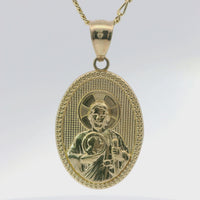 14KT Gold Charm Medium Oval Jesus Holding a Coin with Beaded Border and Plain Bell