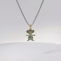 14KT Gold Charm Girl with Light Blue CZ Stone Belly and Plain Bell