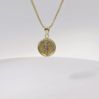 14KT Gold Charm Extra Small Round Crucifix Coin with Plain Background and White CZ Stones Top and Plain Bell