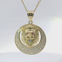 14KT Gold Charm Large Etched Lion Head Center with Red CZ Stones Eyes, White CZ Stone Mouth, Cresent Frame and Plain Bell
