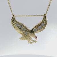 14KT Gold Charm Large Right Facing Soaring Eagle with Round White CZ Stones on Wings, Red CZ Stone Eye, and Plain Bell