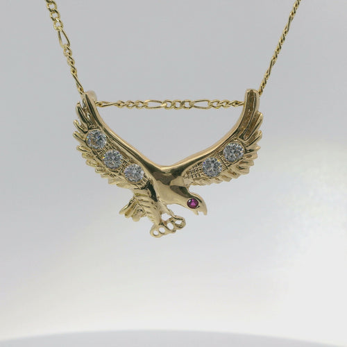 14KT Gold Charm Medium Right Facing Soaring Eagle with Round White CZ Stones on Wings, Red CZ Stone Eye, and Plain Bell