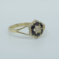 14KT Gold Ring Women's Flower Mini 6 Black Oval Petals with Round White CZ Stones Center and White CZ Stone Leaf Outline Border and Plain Split Band