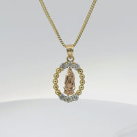 14KT Gold Charm Medium Oval Two Tone Virgin Mary Open Center with Beaded Frame, Six White CZ Stones Frame, and Plain Bell