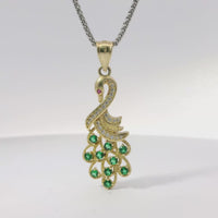 14KT Gold Charm Peacock with Green CZ Stones Tail, White CZ Stones Body, Dark Pink CZ Stone Eye and Plain Bell