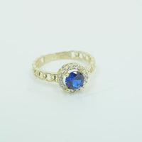 14KT Gold Ring Women's Round Royal Blue Center Stone with White CZ Stone Border and Chino Band